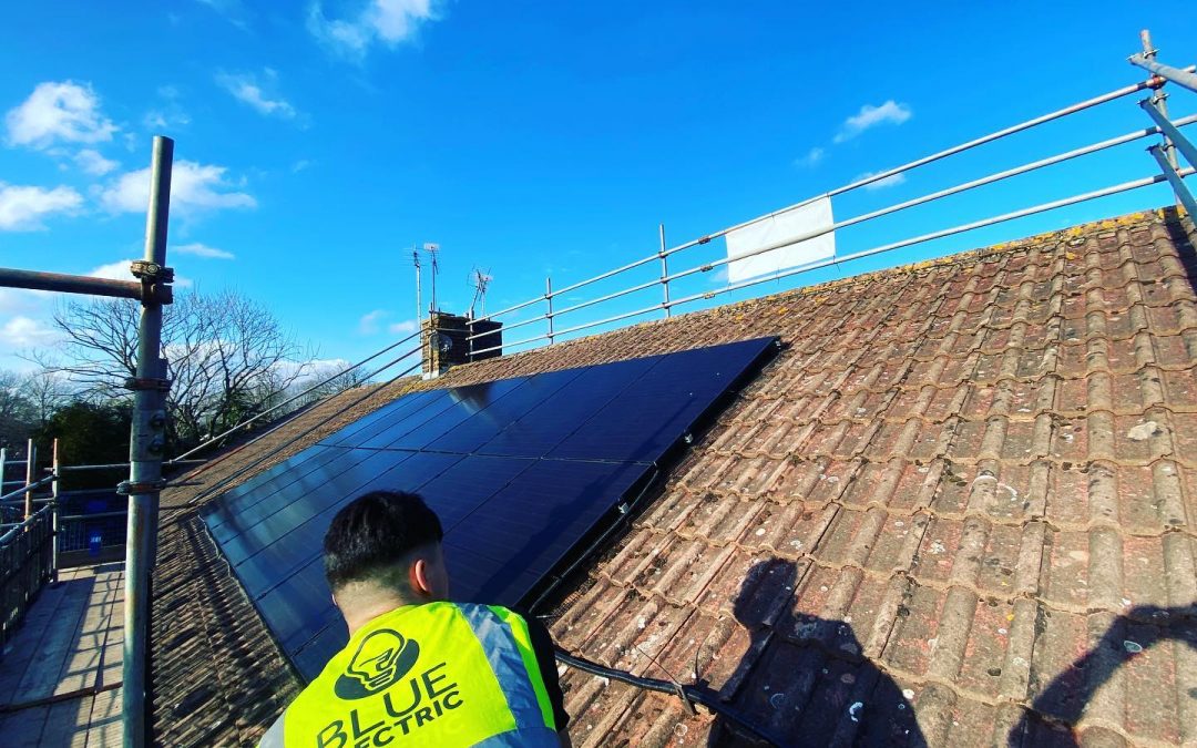 Homeowners installing solar panels